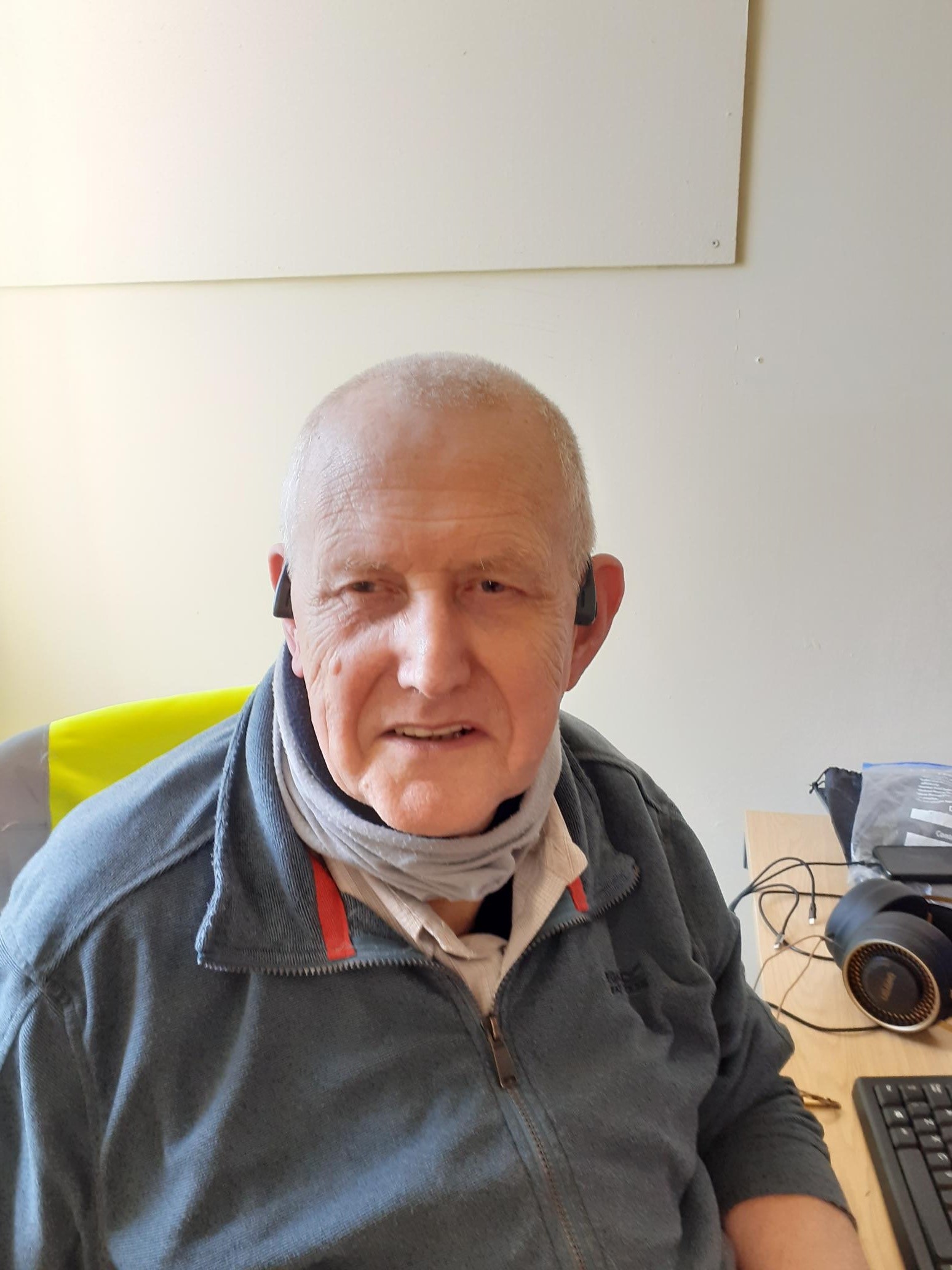 Picture showing David sat at his desk.